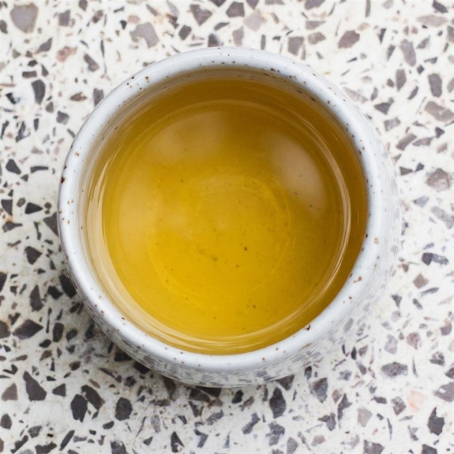 A freshly brewed, golden cup of tea